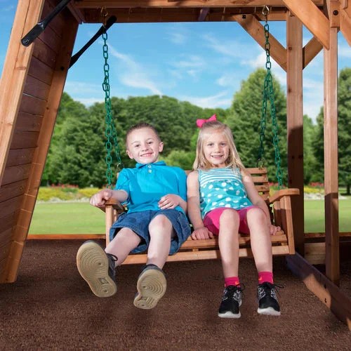 Casavibeo Backyard Discovery Caribbean Swing Set with porch, swings, and climbing features in a backyard setting.