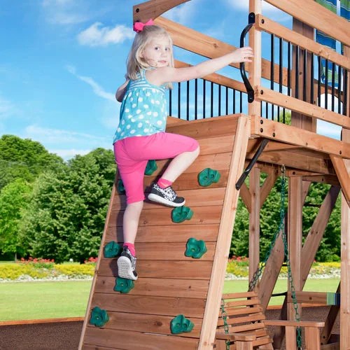 Casavibeo Backyard Discovery Caribbean Swing Set with rock wall and climbing features for kids' outdoor play.