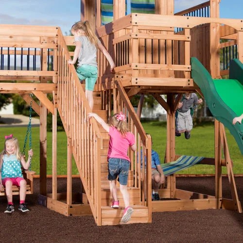 Casavibeo Caribbean Swing Set featuring wooden stairs and climbing frame in a backyard setting