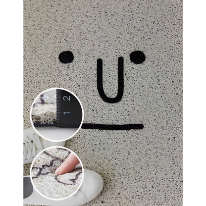 Cheeky smiley print doormat by Mivoza featuring non-slip PVC surface, quick-drying material, measuring 40x60cm for home décor.