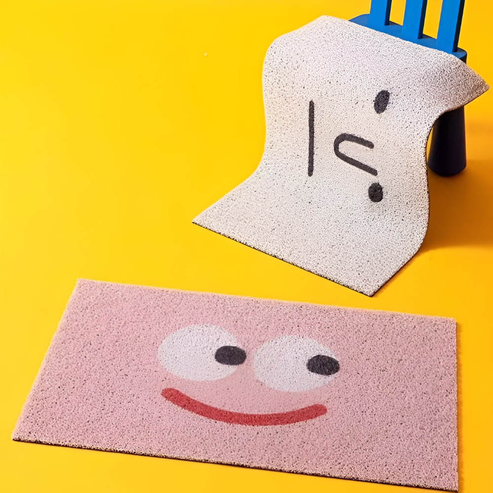 Mivoza smiley print doormat with cheeky face design, non-slip PVC backing, quick-drying, 40x60cm for home décor.