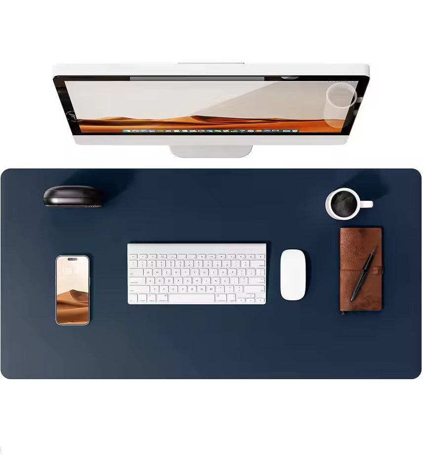 Dark blue leather desk mat by Belro shown on wooden desk, protects and complements home office furniture.