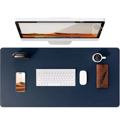 Dark blue leather desk mat by Belro shown on wooden desk, protects and complements home office furniture.