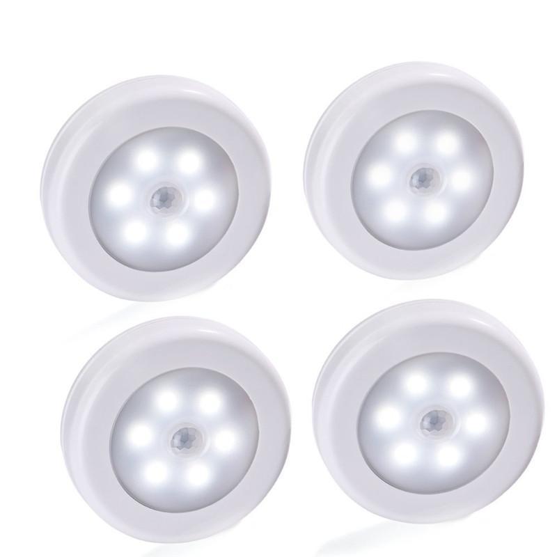 Belro wireless motion sensor LED night light mounted on a wall, providing automatic illumination in a dark room.