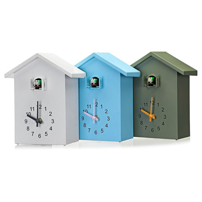 Belro cuckoo clock with traditional wooden design, decorative house shape, and clock face, suitable for home decor.