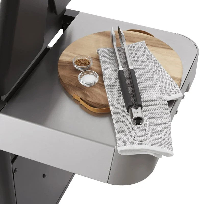 Casavibeo Weber Genesis 4-burner natural gas grill with large prep area and side shelves for outdoor cooking.
