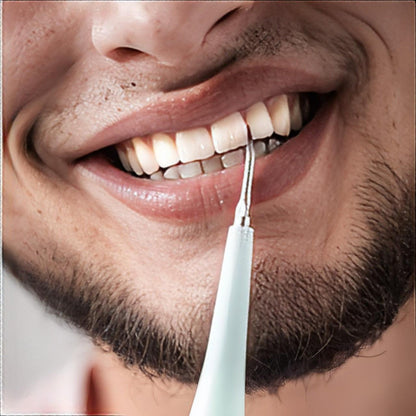 Belro professional dental scaler used for oral hygiene, showing the sleek electronic device with a digital display and cleaning tip.