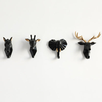 Belro animal head wall hook resembling a bear, mounted on a wall, used for hanging robes and clothing in bedroom decor.
