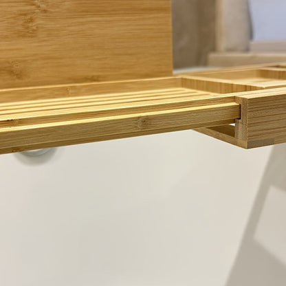 Belro bamboo bathtub tray resting across a bathtub, designed for relaxing baths with space for books, candles, and beverages.