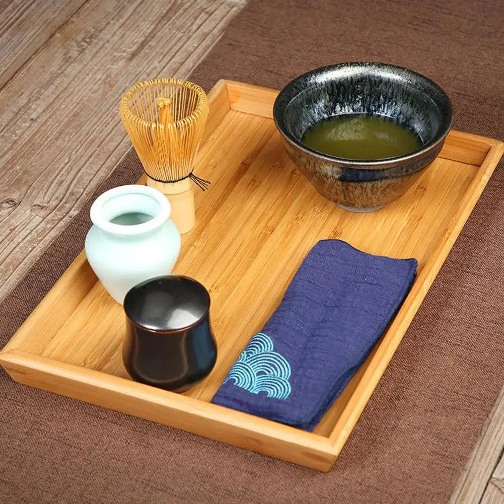 Traditional Belro Matcha Tea Set with bamboo whisk, bowl, and scoop, displayed on a wooden table for home tea preparation.