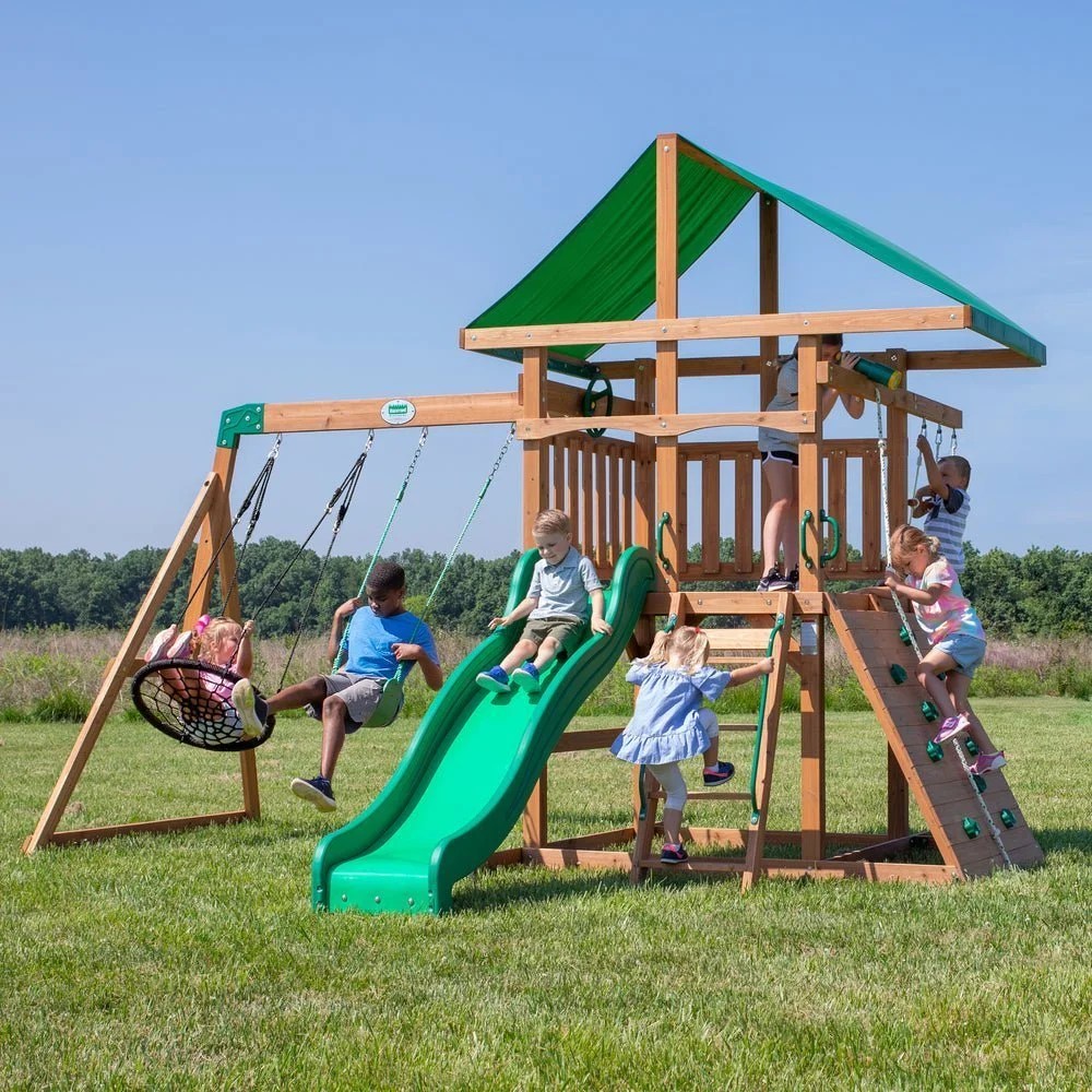 Backyard Discovery Grayson Peak swing set by Casavibeo featuring slide, swings, and climbing elements in a backyard setting.