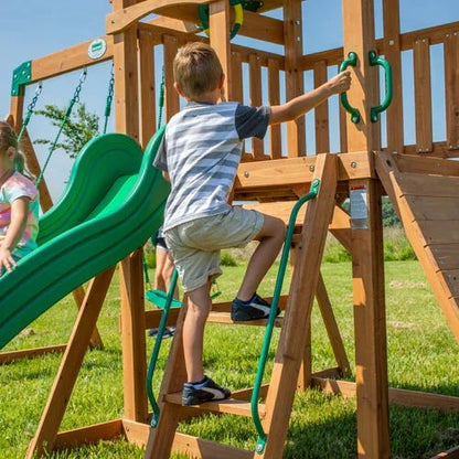 Casavibeo Backyard Discovery Grayson Peak Swing Set showing the steps and climbing ladder in a backyard setting.