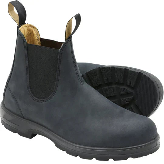 Green waterproof Chelsea boots by BowLift, slip-on unisex style with durable design, set against a natural landscape background.