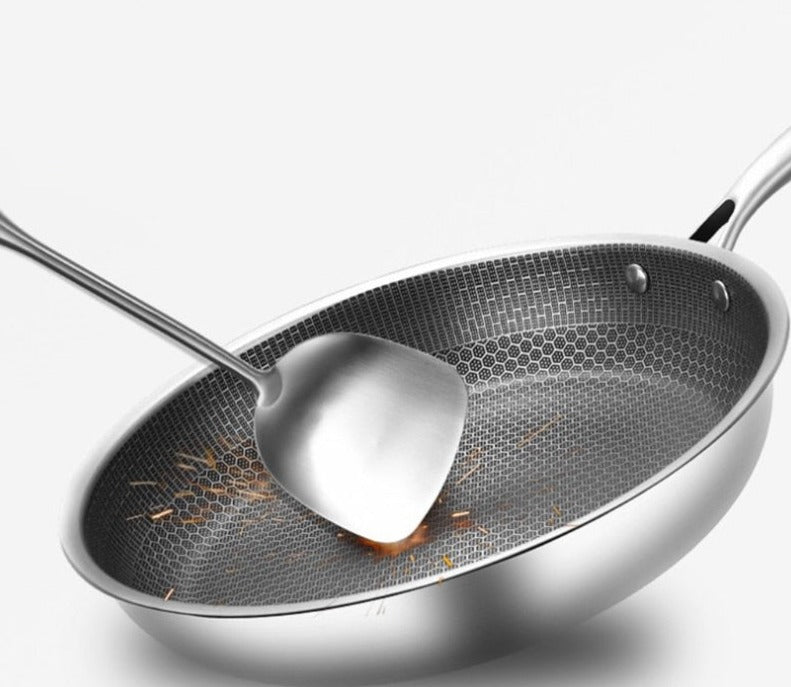 Belro non-stick stainless steel frying pan with a black handle, shown on a stovetop for home and kitchen use.