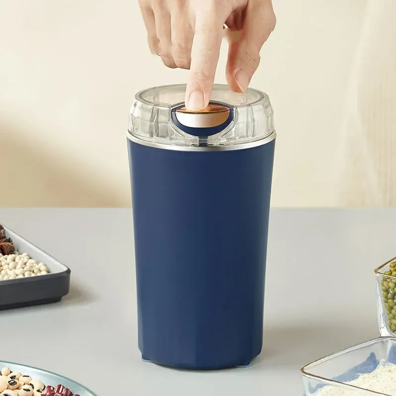 Belro electric mini grinder for kitchen use, compact handheld tool with a silver grinding chamber and ergonomic handle.