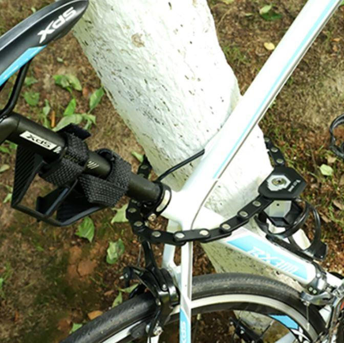 Belro foldable bike lock shown, compact design ideal for outdoor use, with flexible metal segments and secure locking mechanism.
