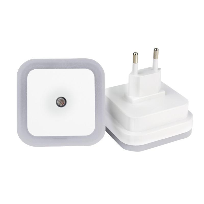 Belro plug-in motion detector smart outlet night light connected to an electrical outlet in a home setting.