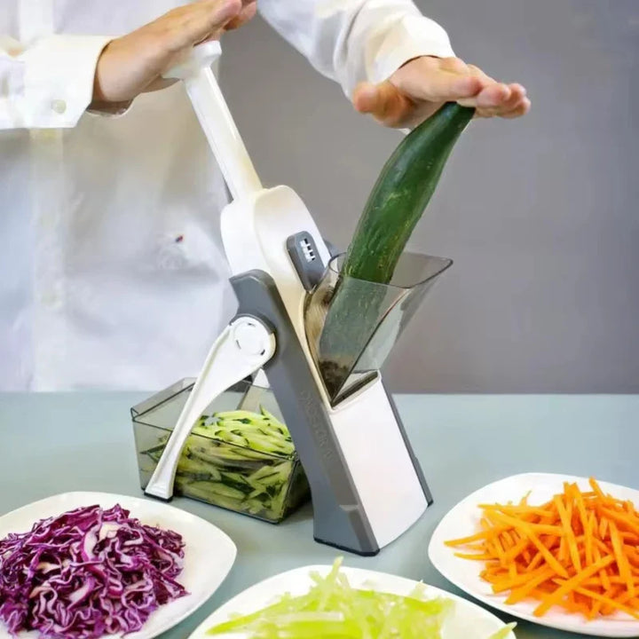 Belro kitchen slicer with adjustable thickness and collection container, showing the slicer blade, dial, and container in a home kitchen setting.