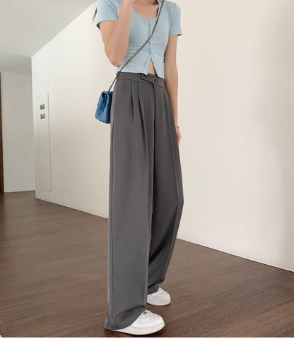 Belro pleated trousers showing a relaxed fit, made from lightweight fabric with a high waist and pleated front design.