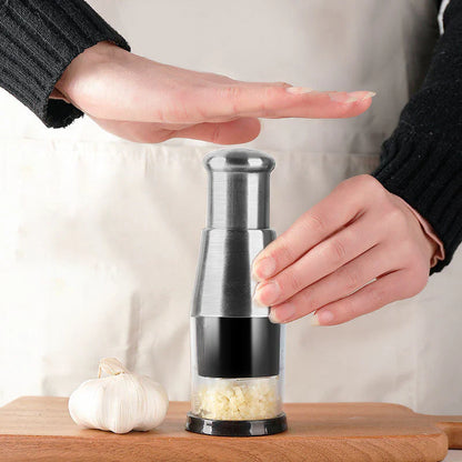 Belro compact garlic chopper for fine chopping, shown with garlic cloves inside, ideal for kitchen and dining use