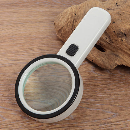 Belro 30x optical magnifier with built-in LED light, handheld device for detailed close-up viewing in electronics and optics.