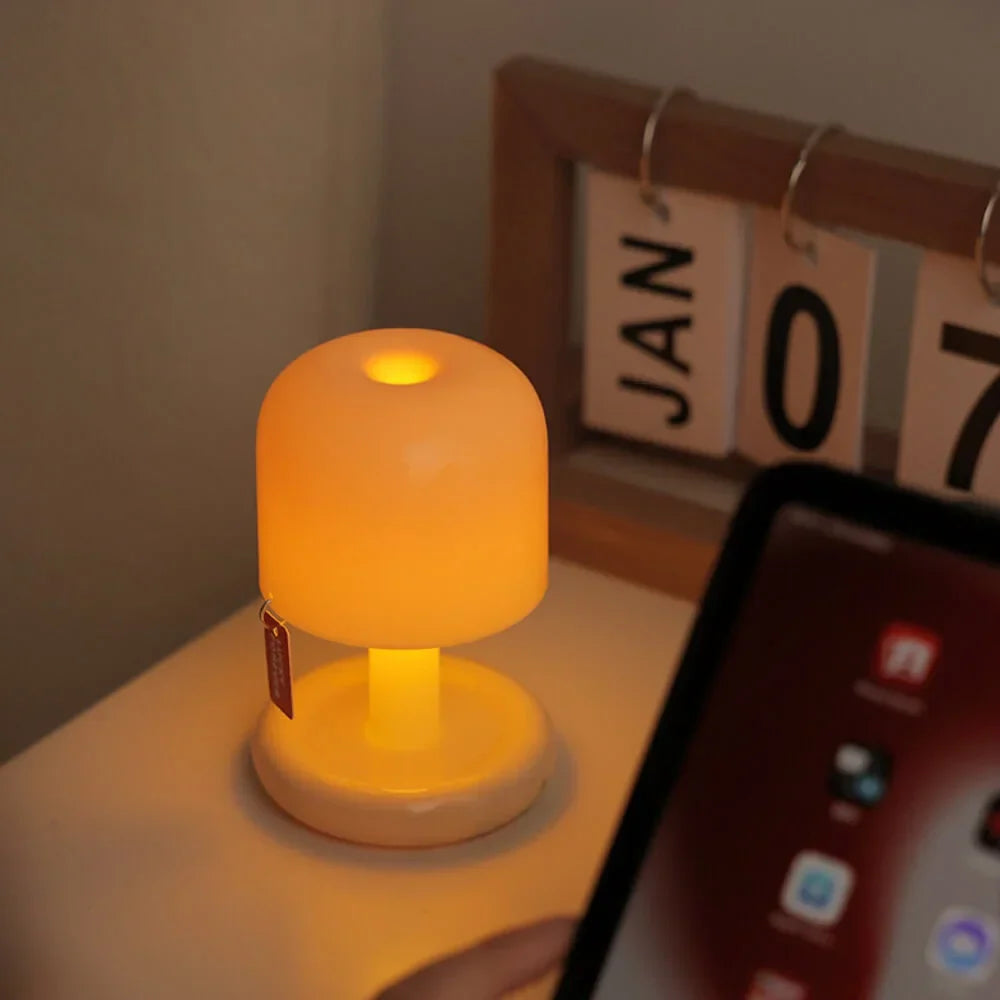 Belro Mini Sunset Light illuminating a room, compact electronic night light with warm sunset glow for cozy ambiance.