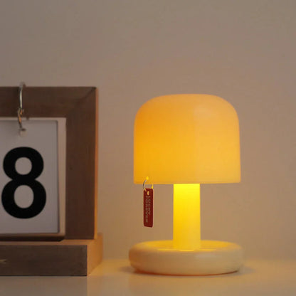 Belro Mini Sunset Light illuminating a cozy bedside table with warm, ambient sunset-inspired glow.
