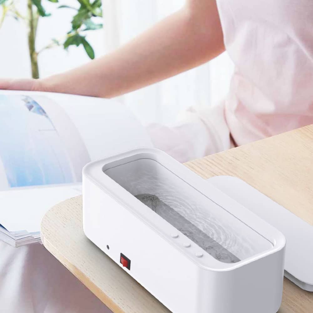 Belro high-frequency USB ultrasonic cleaner for home and outdoor use, featuring a compact design with control buttons and digital display.