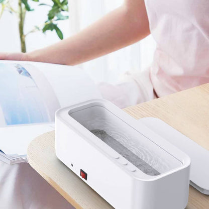 Belro high-frequency USB ultrasonic cleaner for home and outdoor use, featuring a compact design with control buttons and digital display.