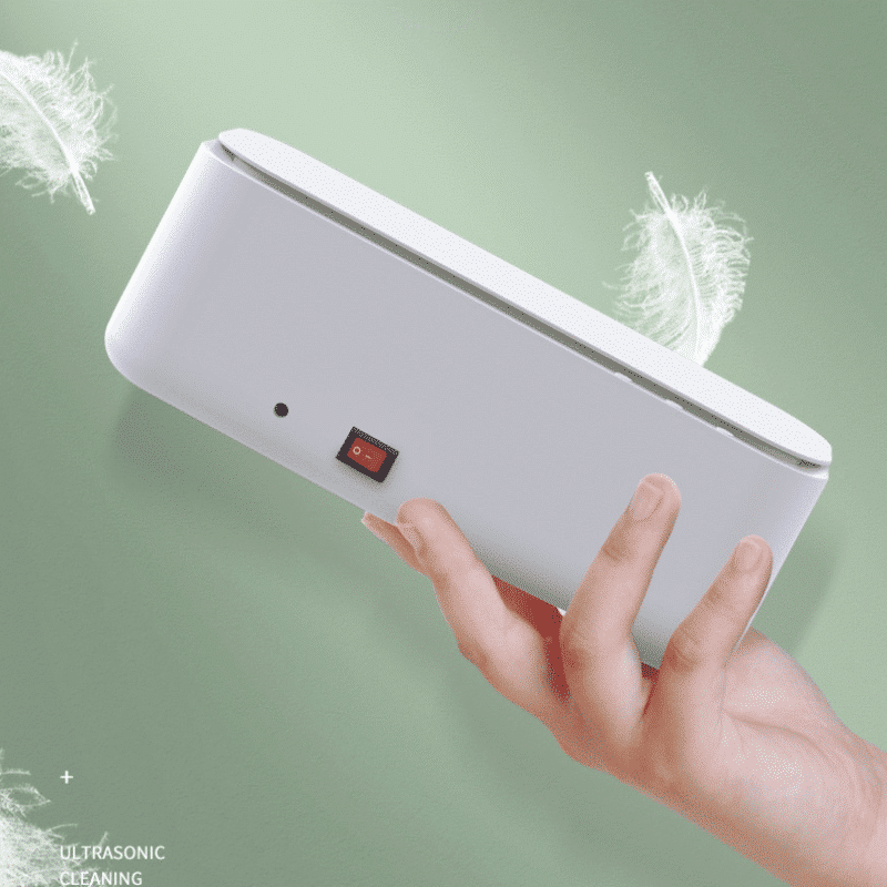 Ultrasonic cleaner by Belro with USB connectivity, designed for home and outdoor use, featuring a compact, sleek white device.