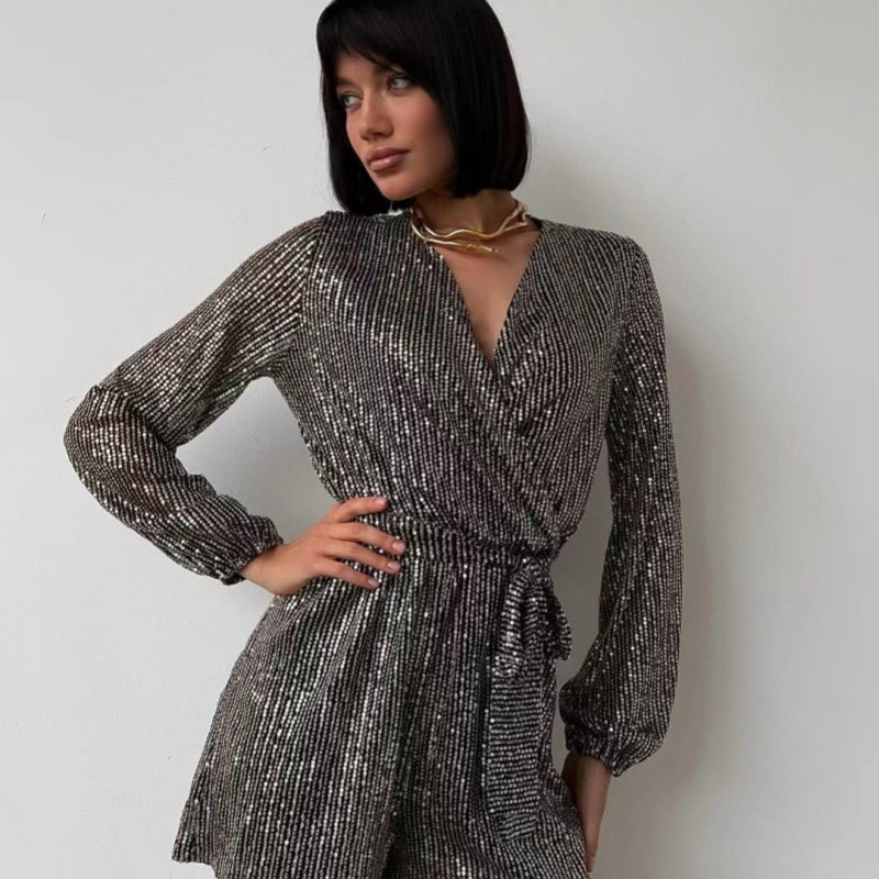 Belro sequin long-sleeved one-piece suit with shiny, reflective sequins and fitted design, perfect for stylish evening wear.