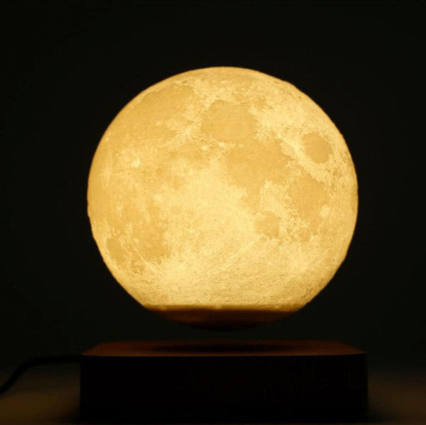Belro magnetically levitated lunar lamp glowing with a soft light, showcasing its spherical lunar design and sleek electronic night light.