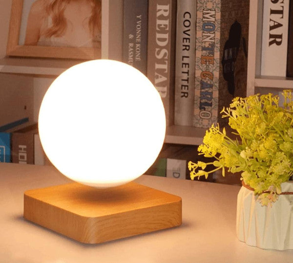 Belro Magnetically Levitated Lunar Lamp glowing softly, showcasing its levitation and moon-like design in a modern night light setting.