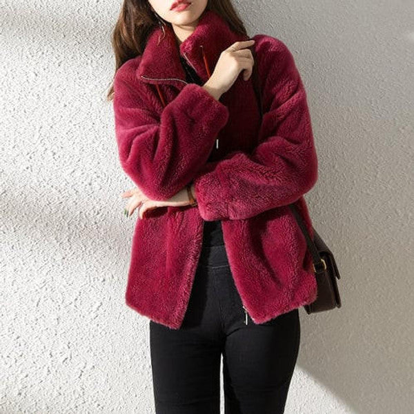 Belro high collar fur down jacket showing a warm, insulated outerwear piece with a high neckline and plush fur trim.