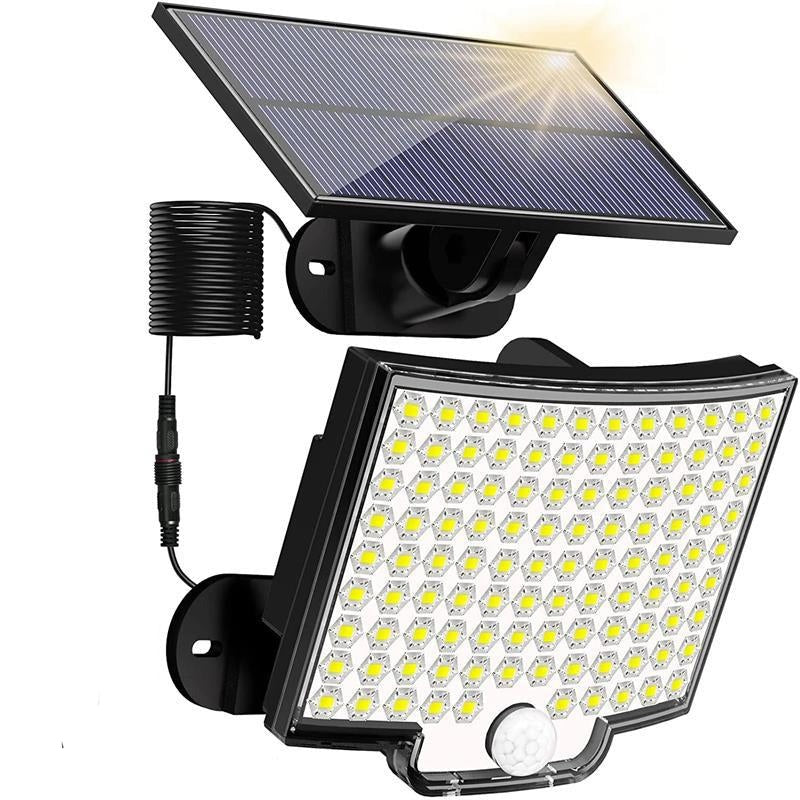 Belro 106 LED solar outdoor light with motion sensor, mounted on a wall in a garden, providing bright illumination for safety.