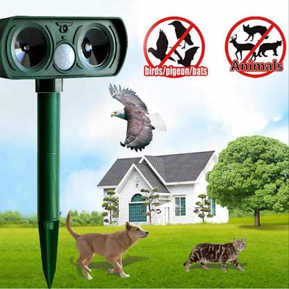 Belro solar-powered ultrasonic animal repellent in outdoor garden setting, designed for pest control and animal deterrence.
