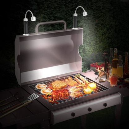 Belro magnetic barbecue LED light attached to a man's clothing, providing hands-free illumination for grilling in low light.