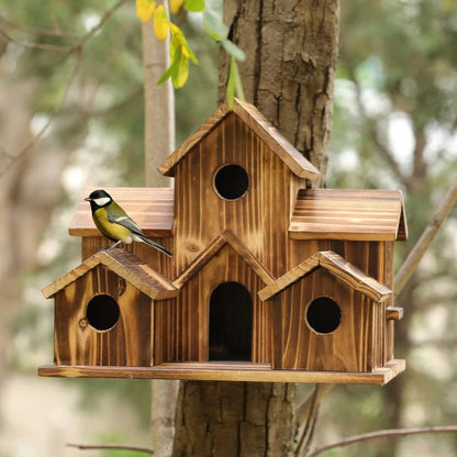 Handcrafted wooden birdhouse with six entry holes, decorative outdoor garden decor by Belro, featuring natural wood finish.