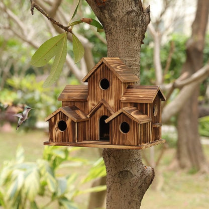 Handcrafted wooden birdhouse with six entry holes, decorative garden decor by Belro for outdoor bird nesting.