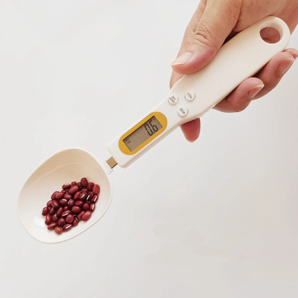 Digital measuring spoon by Belro with electronic display, used for precise ingredient measurement in kitchen or culinary applications.