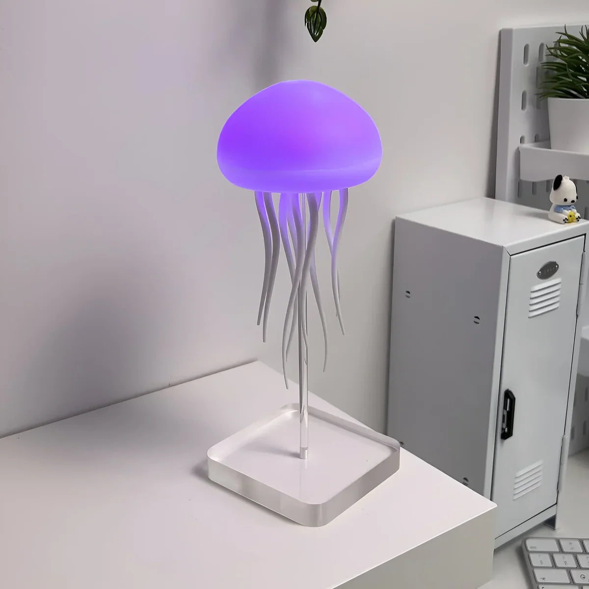 Colorful Dancing Jellyfish Lamp by Belro in outdoor garden setting, featuring flowing, illuminated jellyfish design for home decor.