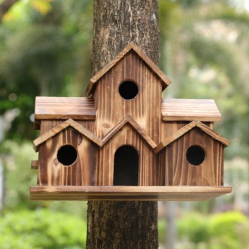 Handcrafted wooden birdhouse by Belro with six entrance holes, perfect for garden decor and attracting birds.