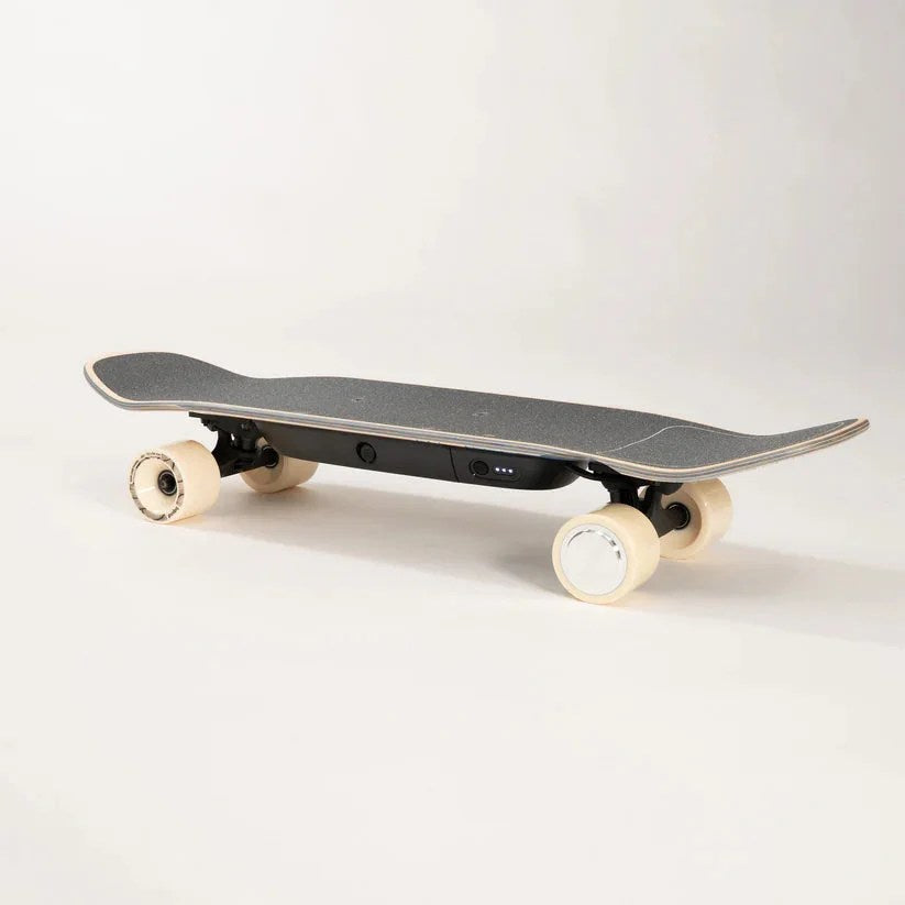 Casavibeo Liquid Skateboard LQS-1 with black grip tape and colorful deck design, shown from top view.