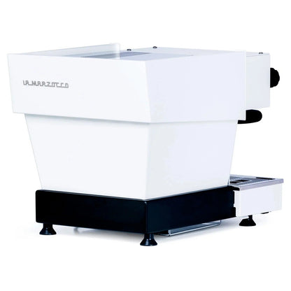White La Marzocco Linea Mini espresso machine by Casavibeo, with detailed controls and portafilter, on a kitchen countertop.