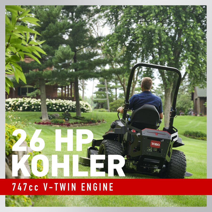 Toro TITAN MAX Havoc Edition 60-inch zero-turn mower with 26 HP engine and 747cc engine, shown in a large outdoor yard setting.
