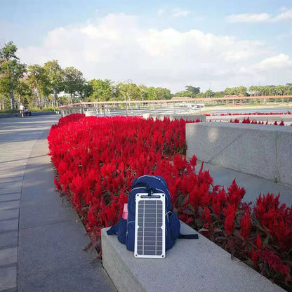 Belro waterproof solar panel with portable USB battery for charging devices outdoors, outdoor electronics power solution.