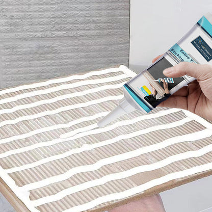 Belro strong adhesive for loose tiles, showing a tube of tile adhesive with application tip and a tiled surface.