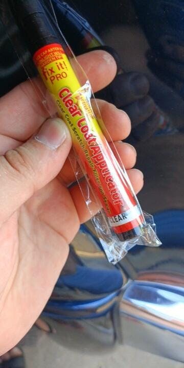 Belro Car Scratch Remover Pen for home and garden, shows the pen used on a car's scratched surface for quick repair.