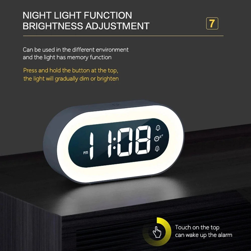 Belro Gentle Light Alarm Clock displaying a soft, glowing night light on a bedside table.