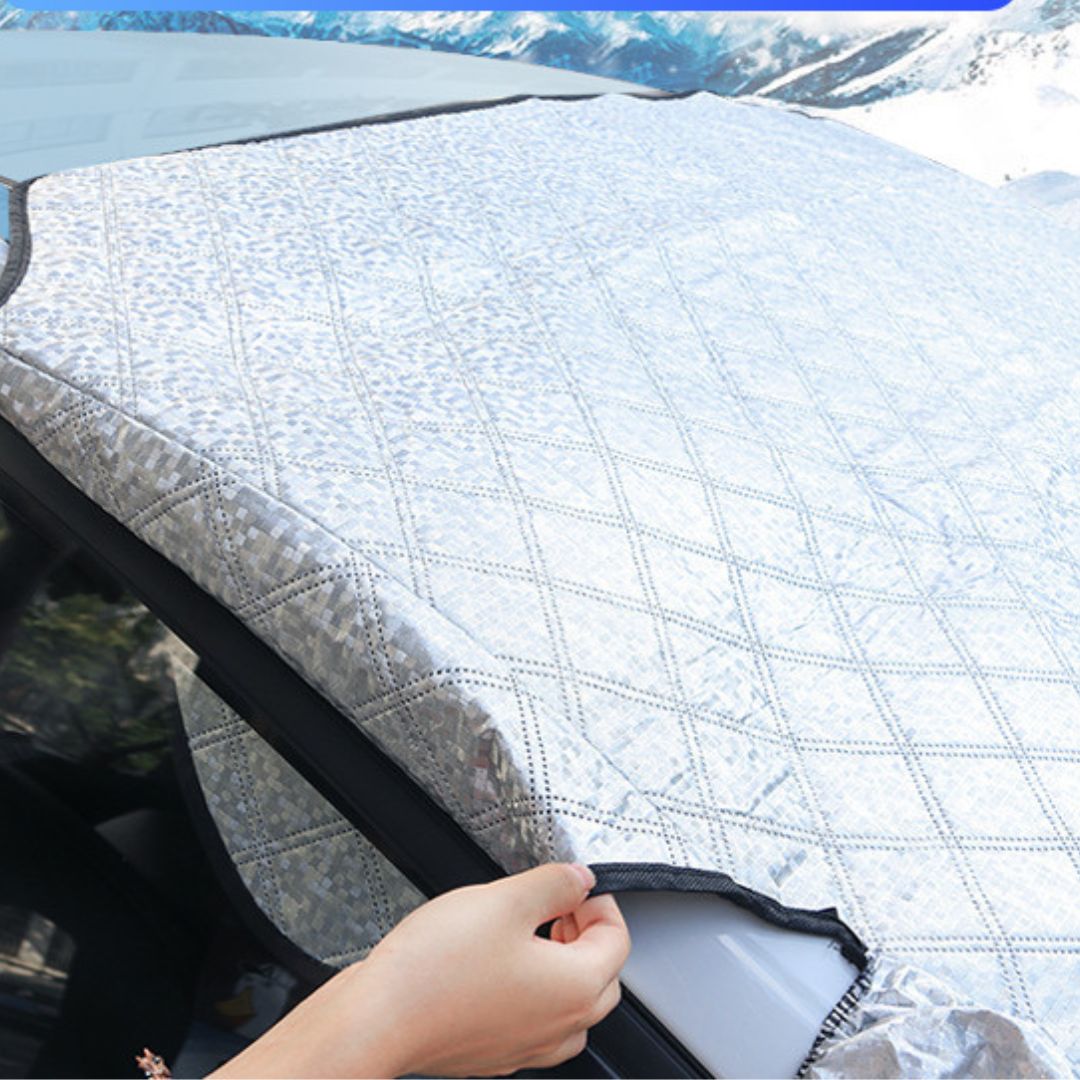Belro Winterproof Magnetic Windshield Cover installed on a car windshield to protect against snow and ice.